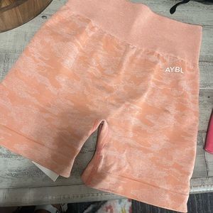 NEVER WORN AYBL camo seamless shorts. Scrunch butt. Peach color. Size small.
